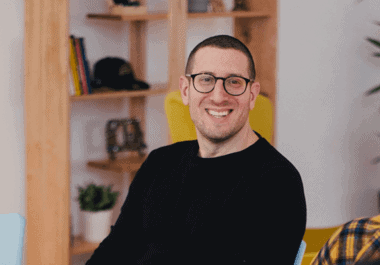 Focused professional male in modern office environment, emphasizing outcome-driven approaches and innovative solutions.